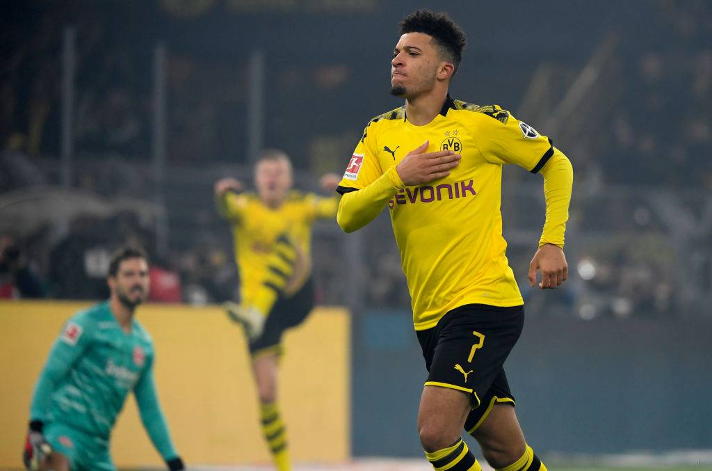 Dortmund's English midfielder Jadon Sancho celebrate scoring during the German first division Bundesliga football match BVB Borussia Dortmund vs Eintracht Frankfurt, in Dortmund, western Germany on February 14, 2020. (Photo by INA FASSBENDER / AFP) / RESTRICTIONS: DFL REGULATIONS PROHIBIT ANY USE OF PHOTOGRAPHS AS IMAGE SEQUENCES AND/OR QUASI-VIDEO (Photo by INA FASSBENDER/AFP via Getty Images)